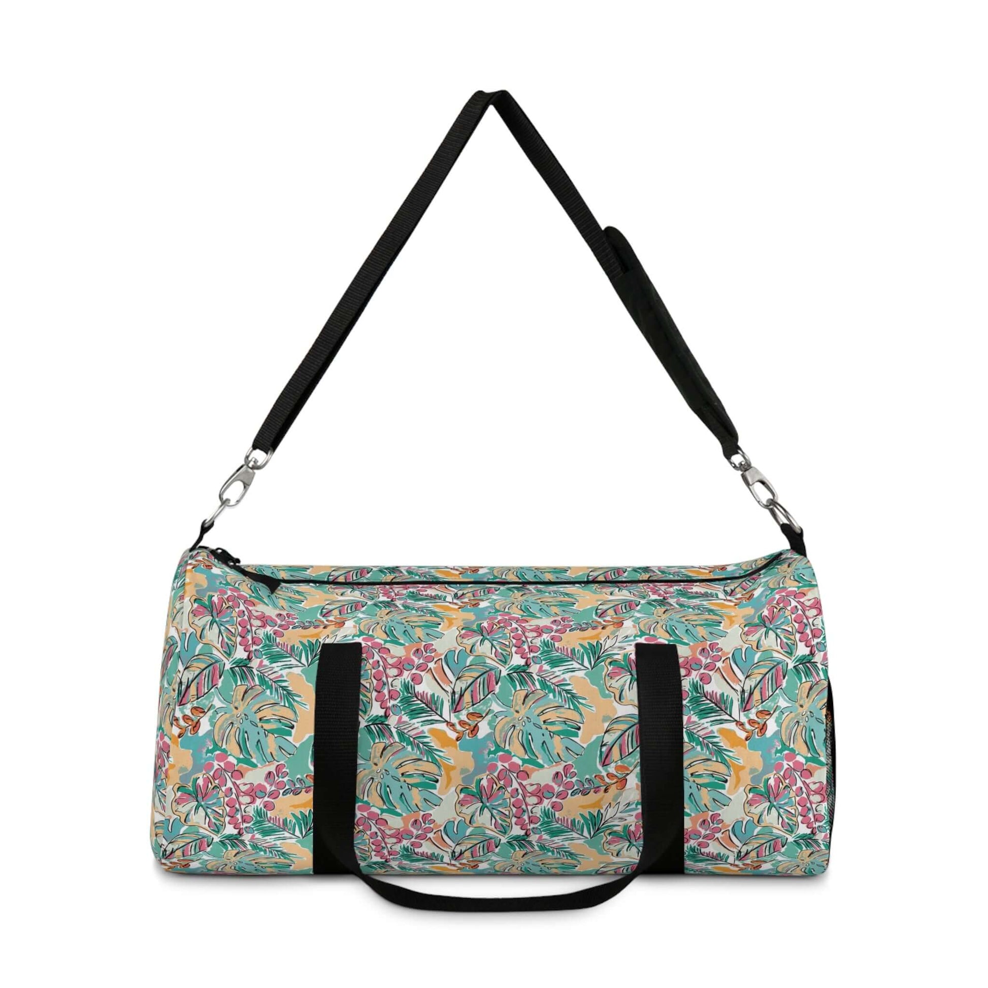 Vibrant Flowers Duffel BagIndulge in luxurious travel with our Vibrant Flowers Duffel Bag. Adorned with a striking floral design, this duffel bag is not only visually stunning but also highly functional. Its spacious interior allows for easy organization