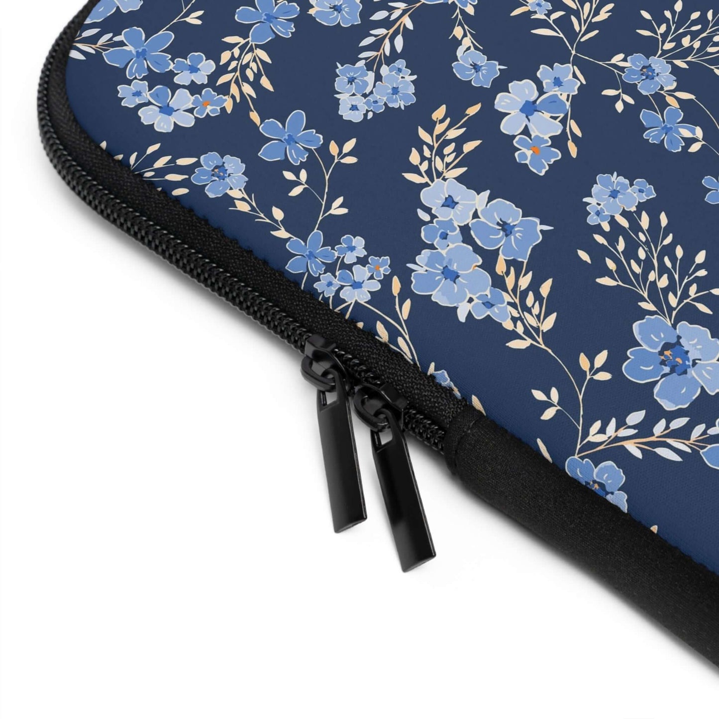 Wildflowers Laptop SleeveThe Wildflowers Laptop Sleeve provides reliable protection for your laptop while showcasing a beautiful wildflower pattern. With a durable construction and soft interior lining, your laptop stays safe and secure while on the go. T