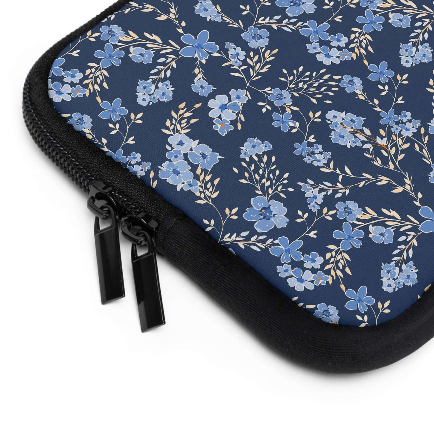 Wildflowers Laptop SleeveThe Wildflowers Laptop Sleeve provides reliable protection for your laptop while showcasing a beautiful wildflower pattern. With a durable construction and soft interior lining, your laptop stays safe and secure while on the go. T