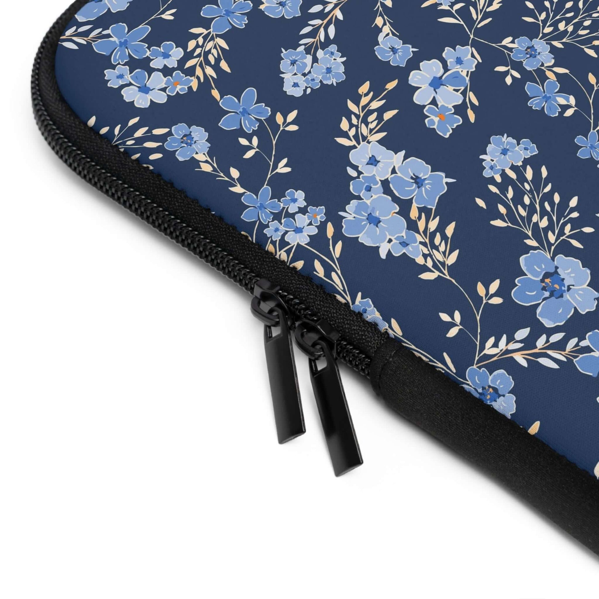 Wildflowers Laptop SleeveThe Wildflowers Laptop Sleeve provides reliable protection for your laptop while showcasing a beautiful wildflower pattern. With a durable construction and soft interior lining, your laptop stays safe and secure while on the go. T